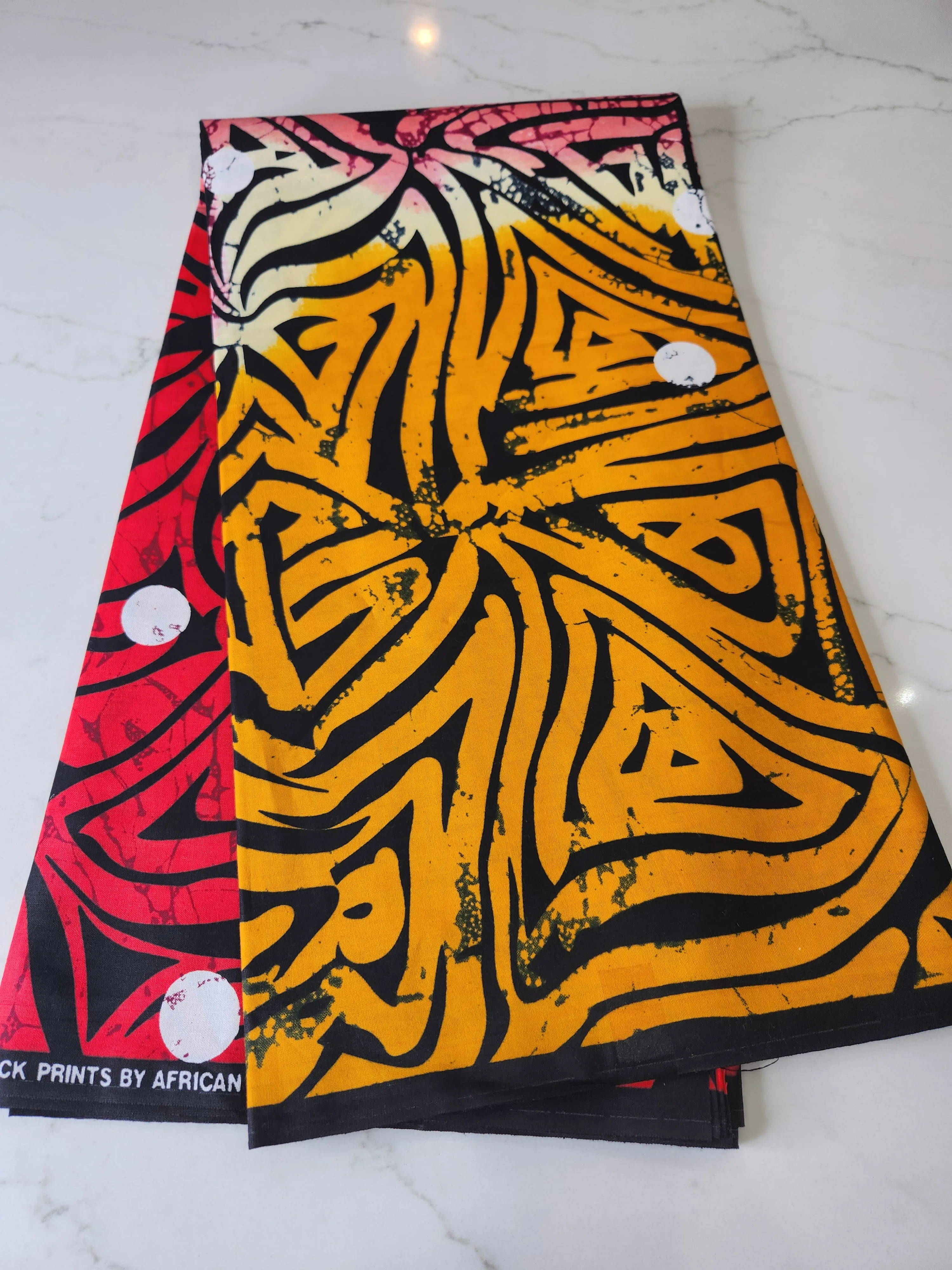 Black, Orange, and Red Ankara Print Fabric